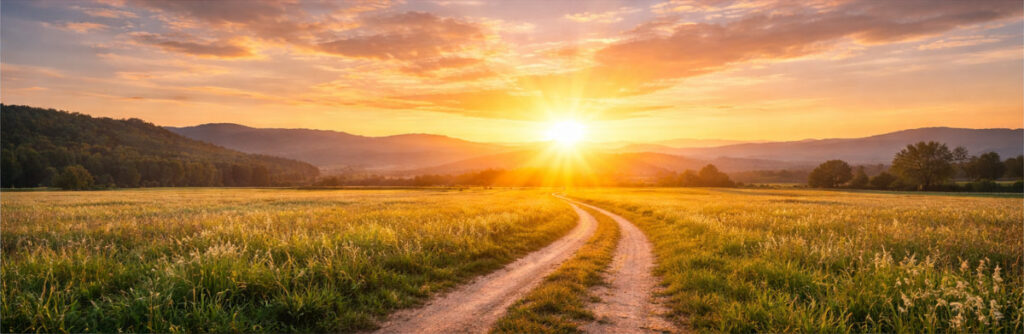Sonnenaufgang über einem Weg als Symbol für Hoffnung und einen Neustart im Leben